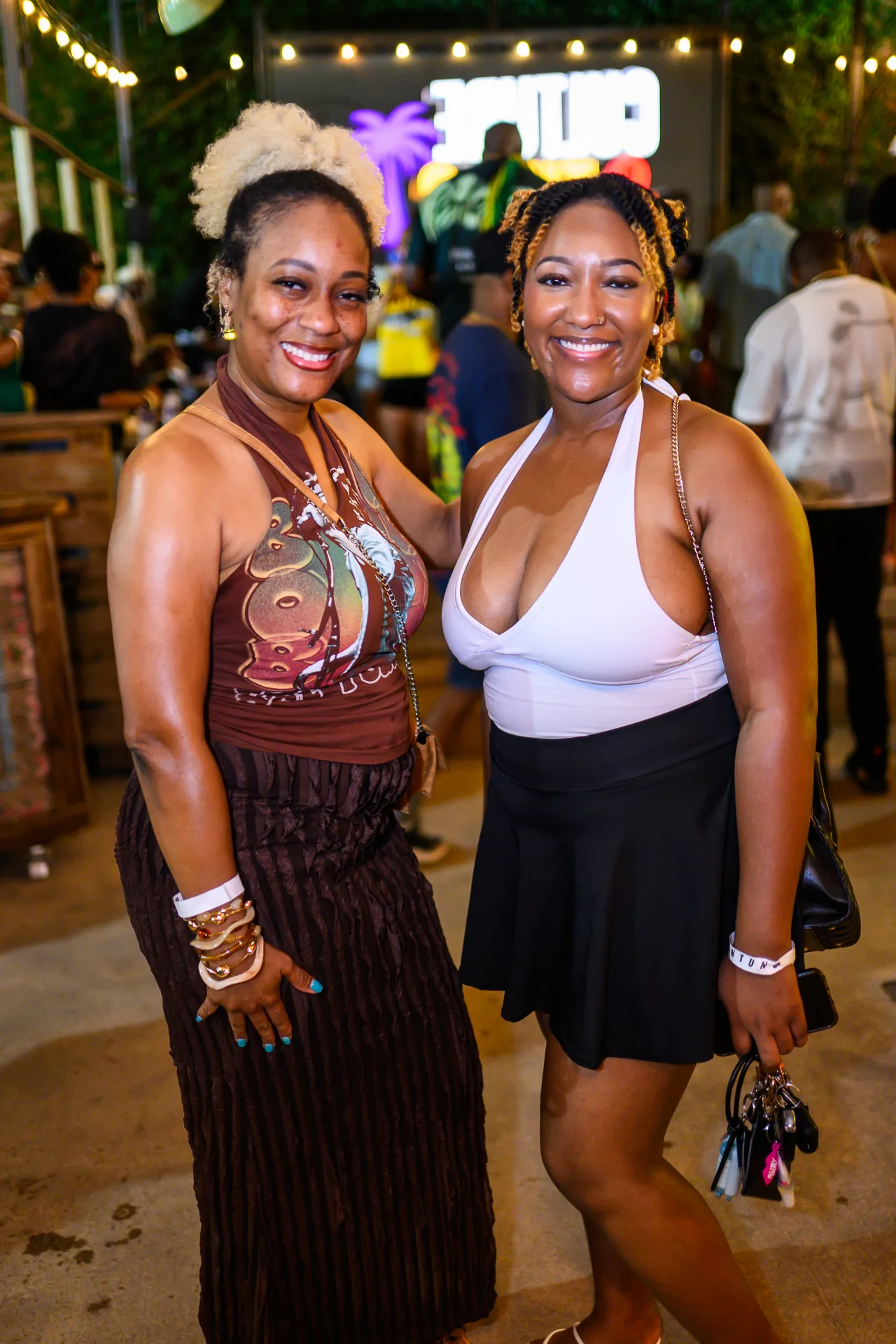 Two friends smiling together at the September 4 Culture & Tings event.